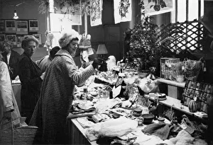 Bric A Brac: People looking at items on a fundraising stall