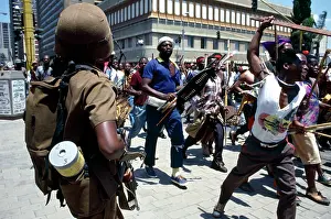 Assegais: People, mainly men, armed with traditional weapons