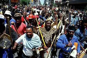 Assegais: People, mainly men, armed with traditional weapons