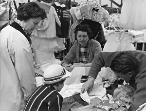 Schoolgirls: People at a market stall