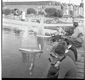 Rockery: People with model sailing boats on a pond