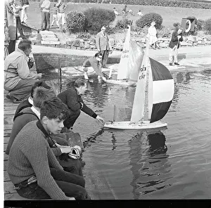 Rockery: People with model sailing boats on a pond