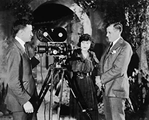 Cinematographers: Three people with movie camera