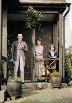 Drainpipe: Three people outside a house