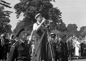 Cinematography: People in a park, with cine camera
