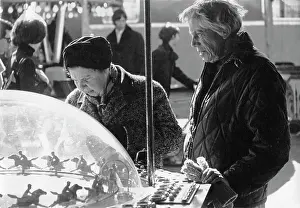 Activated: People play a fairground gambling machine