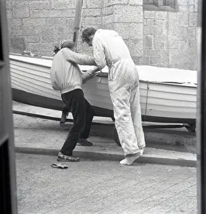 A Flying History - Peter Keating Aviation Collection: Two people preparing a sailing dinghy