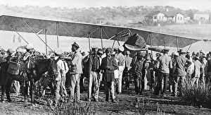 Landed: People in front of a propeller plane in German