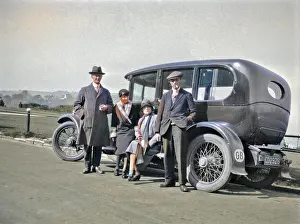 John Maclellan: Four people relaxing by their car at the roadside