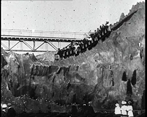Coaster: People Riding Fairground Rides In Brighton