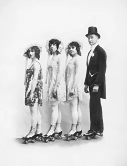 Formalwear: Four people on roller-skates standing in a line