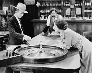 Gamblers: People at roulette table in bar