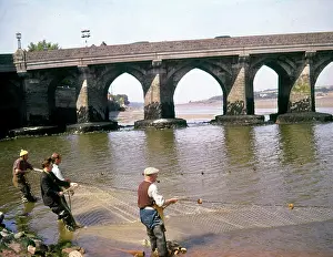 Bideford: People salmon netting at Bideford, Devon