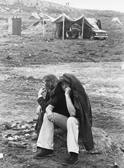 Sheltering: People sheltering on a rainy campground