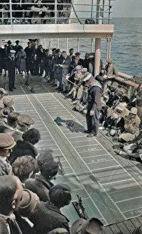 Backward: People on ship's deck playing a game