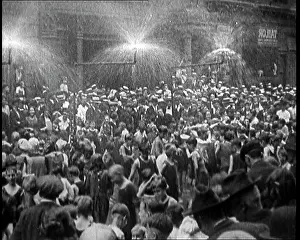 Heatwave: People Being Sprayed With Water During A Heatwave