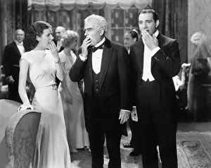 Formalwear: Three people standing together at a formal party
