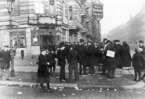 Campaigning: People standing in line in front of a polling