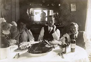Roast: Three people at a table, photographer reflected in mirror
