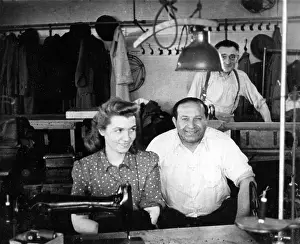 Braces: Three people in a tailors workshop