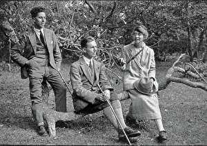 Tweedy: Three people with tree branch