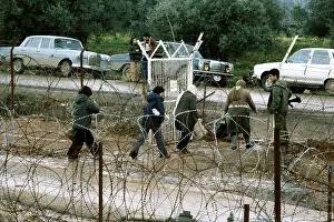 Barbwire: People using a Border Crossing in Israel