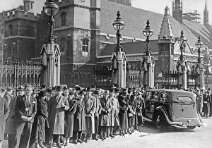 Explanation: People wait in front of the British Parliament, 1938