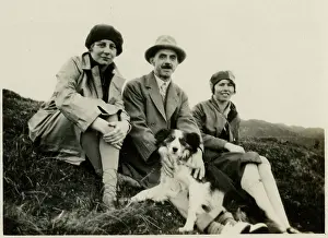 Cloche: Three people out for a walk with a collie dog