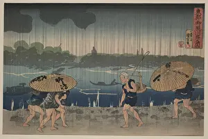 Rainstorm: People walking beneath umbrellas along the seashore during a
