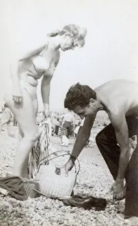 Grenville Collins / Tom Gillmor Collection: The perennial difficulty of getting changed on the beach