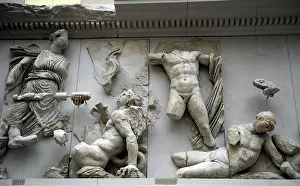 Giants: Pergamon Altar. Leto and Apollo fighting against Tityos and