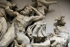 Giants: Pergamon Altar. The three Moirai, goddesses of fate, kill th