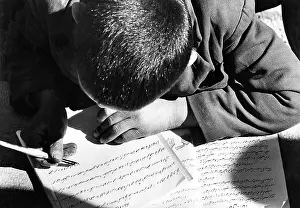 Isfahan: Persian schoolboy doing homework, Isfahan, Persia (Iran)