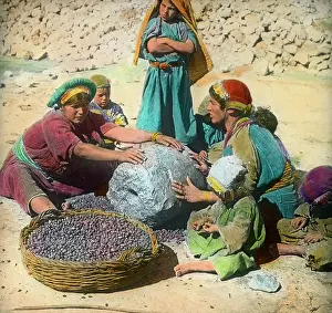 Iran: Persian women using a large grindstone, Iran