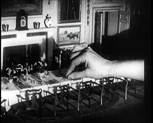 Dollhouse: A Person Inserting Their Hand Into The Dining