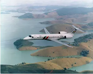 PGA Embraer ERJ-140LR, in-flight, nose left (PT-SYK/CS-TPG)