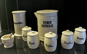 Bottles: Pharmaceutical containers with inscriptions, and mortar. pha