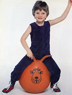 Spacehopper: Photo of youngster sitting on a Spacehopper