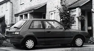 Manufactured: A photograph of a Mazda 323