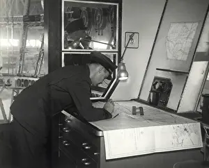 Bending: Photograph of navigation room in a dirigible, circa 1933