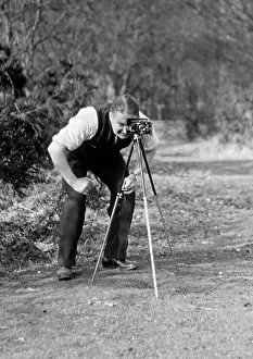 Viewfinder: Photographer with camera and tripod