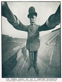 Scraper: Photographer holding a Sky-scraper camera on the roof