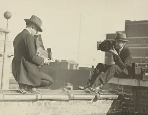 Newsmen: Photographers taking each other's picture with while