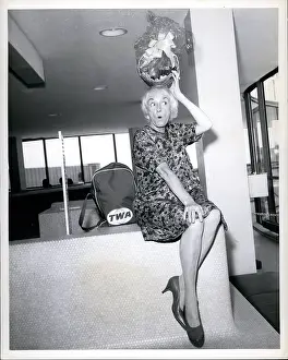 Departs: Phyllis Diller, American comedian, en route for Chicago