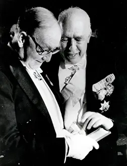 Cockcroft: Physicist John Cockcroft talking with someone