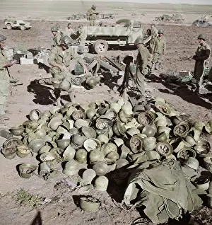 Headwear: Pile of German helmets left by the Tenth and