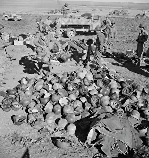 Headwear: Pile of German helmets left by the Tenth and