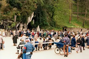 Cures: PILGRIMS AT THE GROTTO