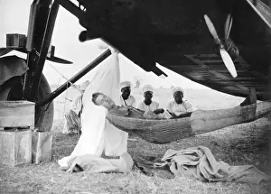 Hammock: Pilot falls asleep under his plane in Africa, 1929