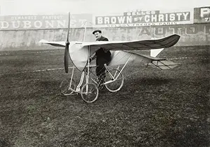 Man Powered: Pilot Sitting on Bi-Cycle Aircraft with Adverts in the ?